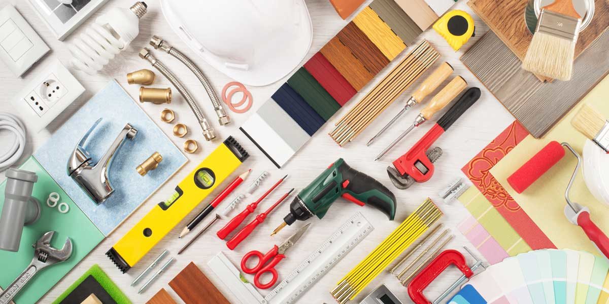 Collage of building materials and tools for how to hire a contractor for home renovations